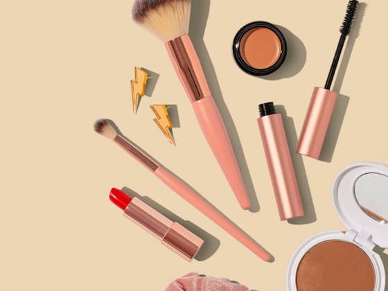 An unbranded set of cosmetics laid out on a plain background, as a shopping ad would show it.